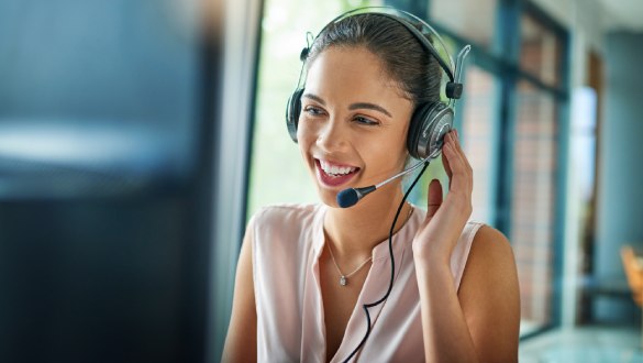 Female office worker talking on headset